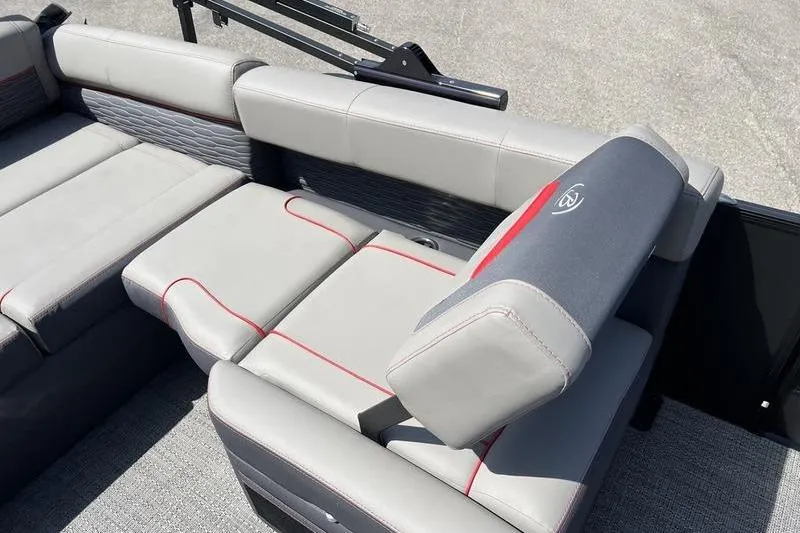 Slide: The Image of 2024 Barletta Corsa 23U boat interior with gray seating and red accents. - 21