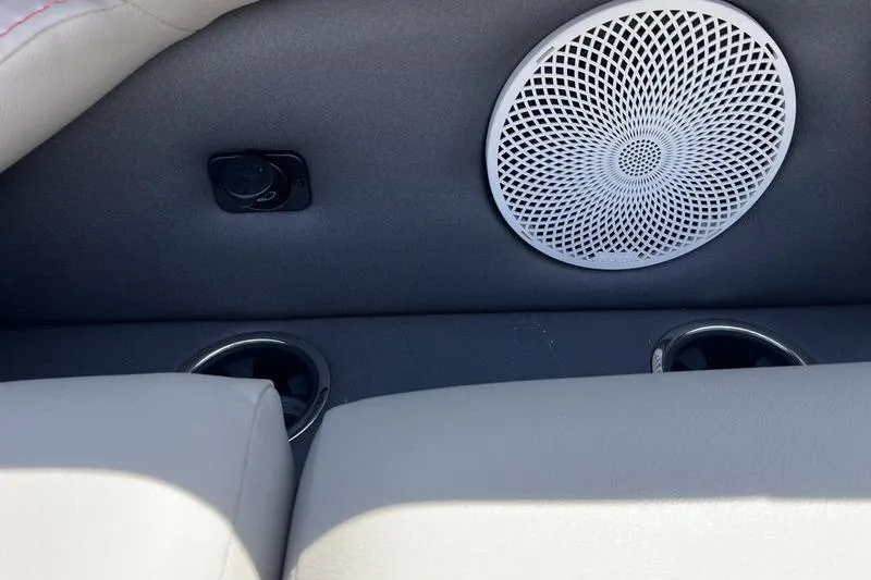 Slide: The Image of 2024 Barletta Corsa 23U interior with speaker and cup holders. - 23