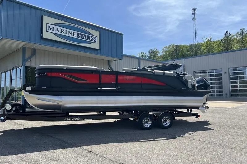 Slide: The Image of 2024 Barletta Corsa 23U pontoon boat on trailer at Marine Sales dealership. - 3