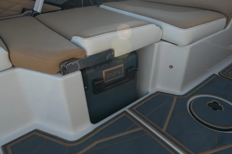 Slide: The Image of 2026 Tigé 24RZX boat interior with cushioned seating and stylish flooring. - 12