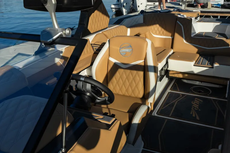 Slide: The Image of Luxurious interior of 2026 Tigé 24RZX boat with tan leather seating. - 15