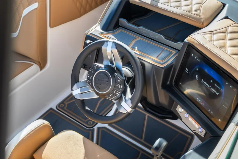 Slide: The Image of 2026 Tigé 24RZX boat interior with modern steering wheel and touchscreen display. - 19