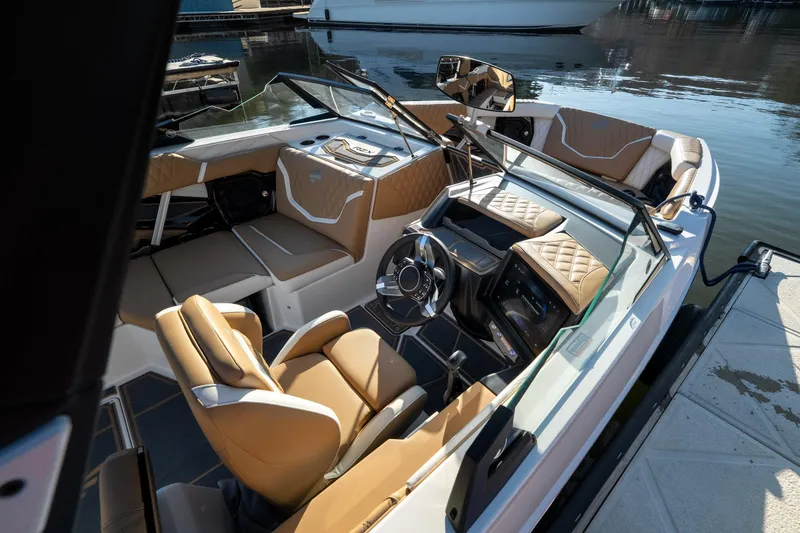 Slide: The Image of 2026 Tigé 24RZX boat interior with luxurious seating and modern dashboard design. - 20