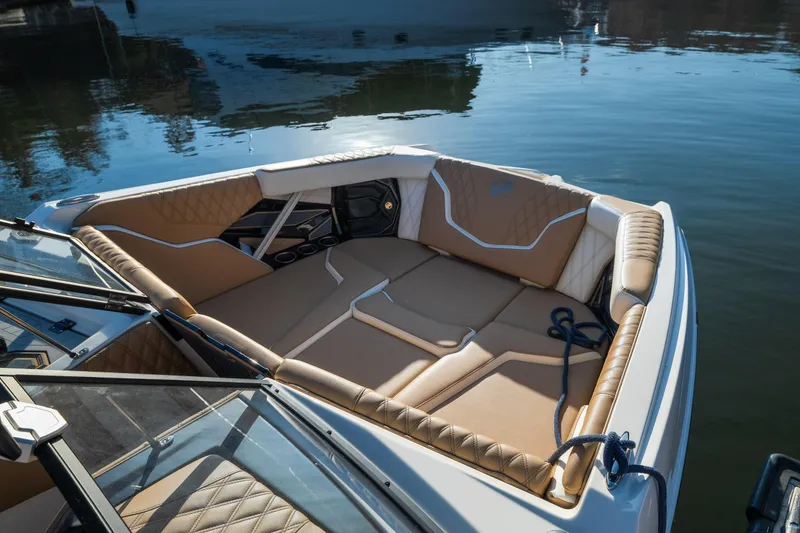 Slide: The Image of 2026 Tigé 24RZX boat interior with luxurious tan seating on calm water. - 21