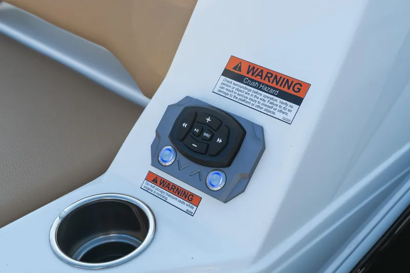Slide: The Image of Control panel and warning labels on 2026 Tigé 24RZX boat interior. - 4
