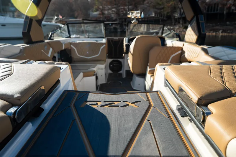 Slide: The Image of 2026 Tigé 24RZX boat interior with luxurious tan seating and sleek design. - 6