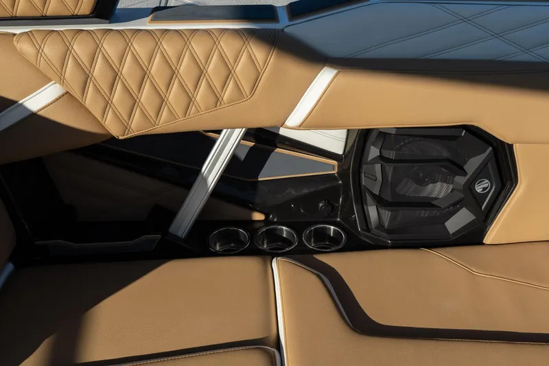 Slide: The Image of 2026 Tigé 24RZX interior with tan leather seats and integrated speaker system. - 8