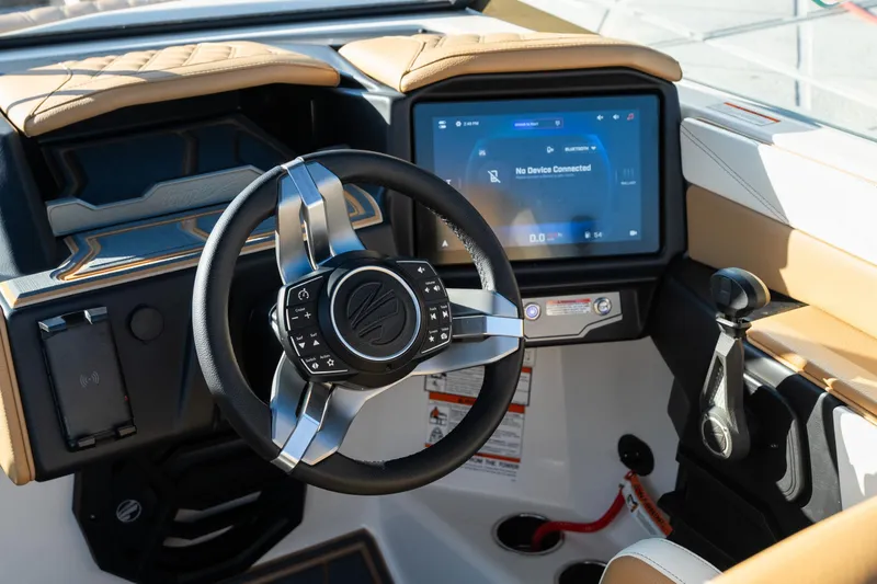 Slide: The Image of 2026 Tigé 24RZX boat dashboard with modern steering wheel and touchscreen display. - 9