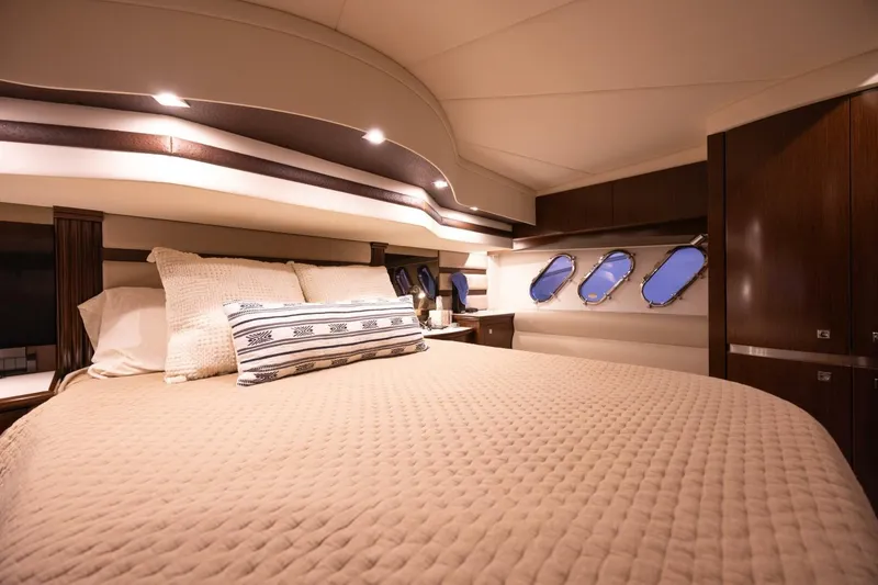 Slide: The Image of Luxurious bedroom interior of 2013 Cruisers Yachts 540 Sports Coupe with elegant bedding. - 12