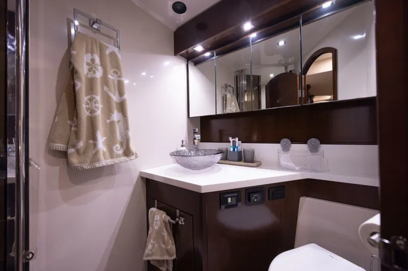 Slide: The Image of Luxurious bathroom in 2013 Cruisers Yachts 540 Sports Coupe with nautical-themed decor. - 13