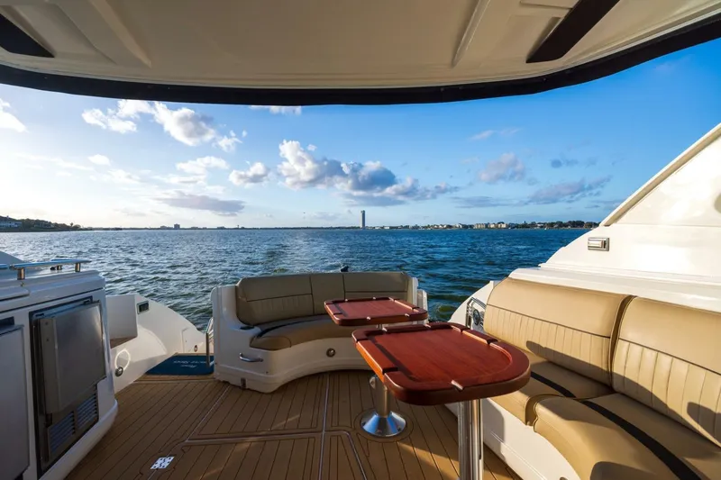 Slide: The Image of Luxurious 2013 Cruisers Yachts 540 Sports Coupe with elegant seating and ocean view. - 16