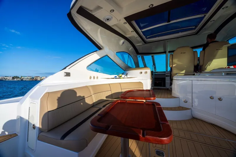 Slide: The Image of 2013 Cruisers Yachts 540 Sports Coupe interior with seating and ocean view. - 19