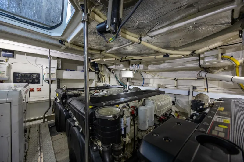 Slide: The Image of Engine room of 2013 Cruisers Yachts 540 Sports Coupe, showcasing mechanical components. - 33