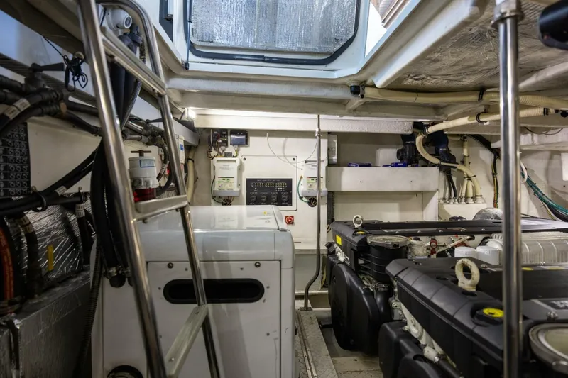 Slide: The Image of Engine room of 2013 Cruisers Yachts 540 Sports Coupe with visible machinery and equipment. - 34