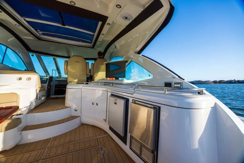 Slide: The Image of Luxurious 2013 Cruisers Yachts 540 Sports Coupe interior with scenic ocean view. - 18