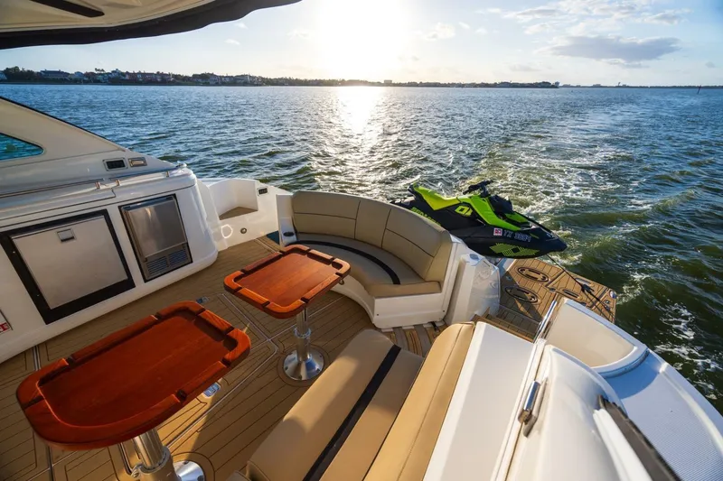 Slide: The Image of Luxurious 2013 Cruisers Yachts 540 Sports Coupe with elegant deck and scenic water view. - 20