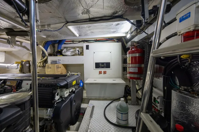 Slide: The Image of Engine room of 2013 Cruisers Yachts 540 Sports Coupe with equipment and fire extinguisher. - 27