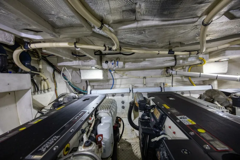 Slide: The Image of Engine room of 2013 Cruisers Yachts 540 Sports Coupe with visible machinery and piping. - 37