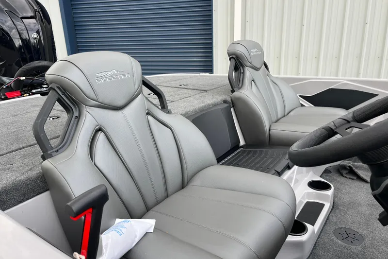 Slide: The Image of 2026 Skeeter ZXR21 SE boat interior with sleek gray seats and modern design. - 11