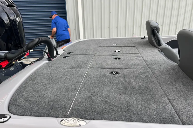 Slide: The Image of 2026 Skeeter ZXR21 SE boat deck with storage compartments and seating. - 12