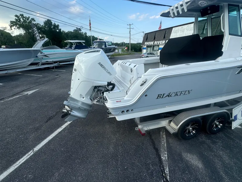 Slide: The Image of 2026 Blackfin 252 CC boat with Mercury outboard engine on a trailer. - 4