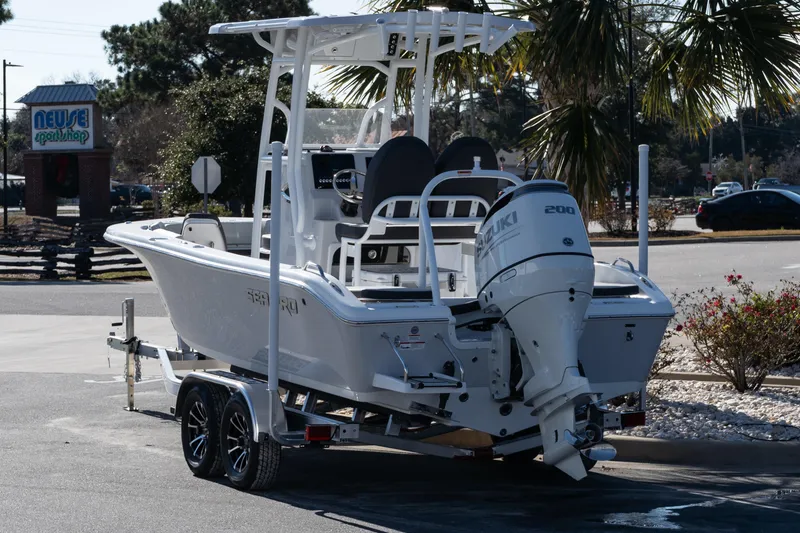 Slide: The Image of 2026 Sea Pro 202 Center Console boat with Suzuki engine on a trailer. - 4