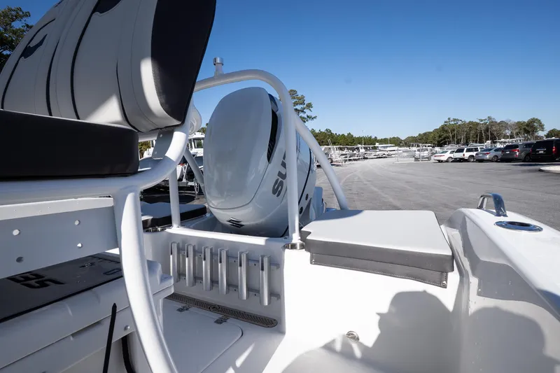 Slide: The Image of 2026 Sea Pro 202 Center Console boat with sleek design, parked outdoors under clear blue sky. - 7