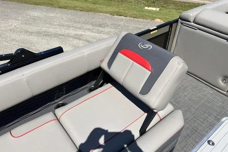 Slide: The Image of 2024 Barletta Corsa 23U boat seat with gray and red accents, outdoor setting. - 11