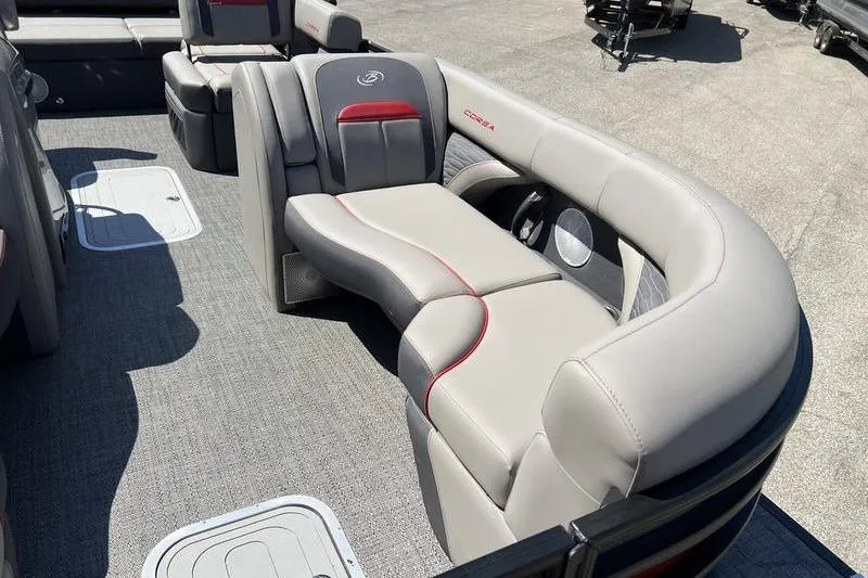 Slide: The Image of 2024 Barletta Corsa 23U pontoon boat interior with stylish gray seating and red accents. - 7
