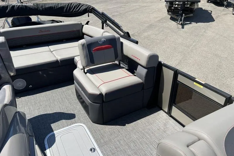 Slide: The Image of 2024 Barletta Corsa 23U pontoon boat interior with gray seating and modern design. - 9