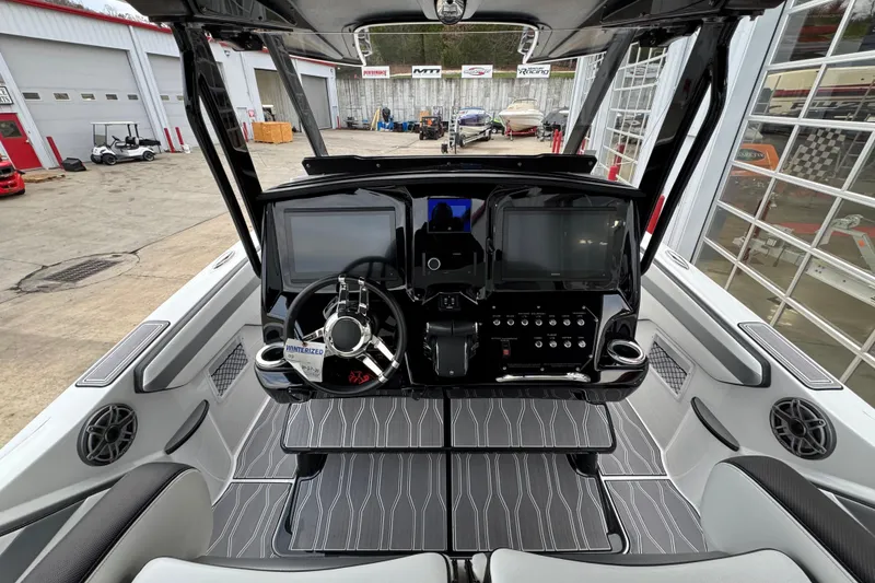 Slide: The Image of 2023 Sunsation 32CCX boat cockpit with modern dashboard and steering wheel. - 11