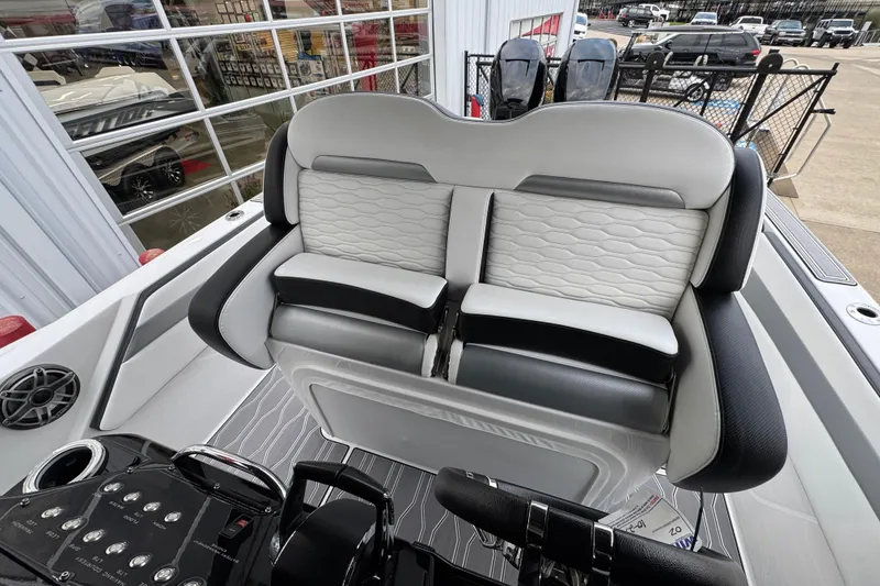 Slide: The Image of 2023 Sunsation 32CCX boat interior with stylish seating and modern controls. - 15