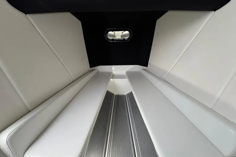 Slide: The Image of 2023 Sunsation 32CCX cabin interior with sleek white seating and modern design. - 19