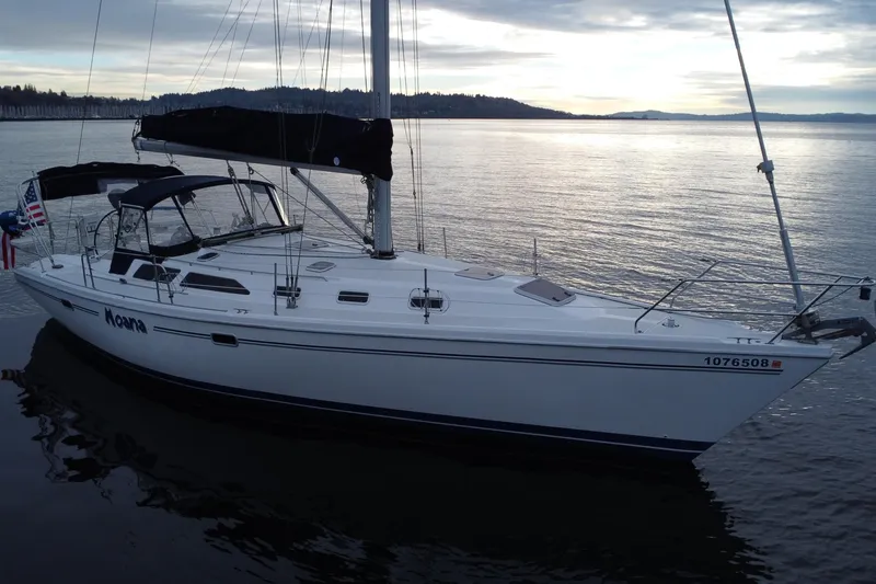 The Image of 1998 Catalina 42 MkII sailboat on calm water at sunset. - 0