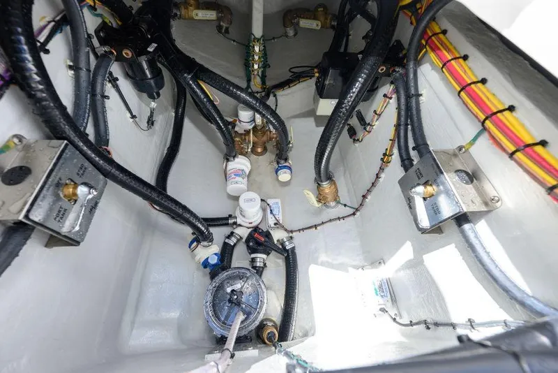 Slide: The Image of Interior view of 2025 SeaVee 320B boat's engine compartment with wiring and components. - 15