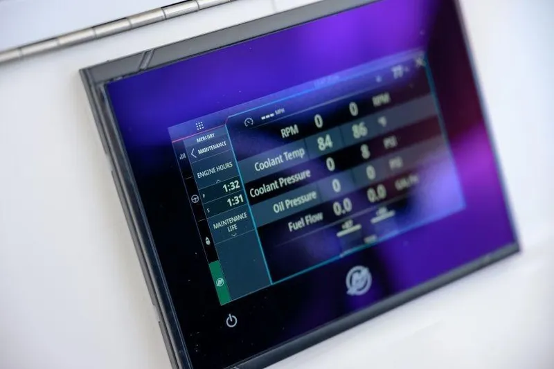 Slide: The Image of Digital display panel on 2025 SeaVee 320B boat showing engine metrics. - 16