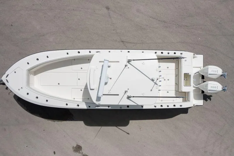 Slide: The Image of Overhead view of 2025 SeaVee 320B boat with dual engines on a concrete surface. - 5