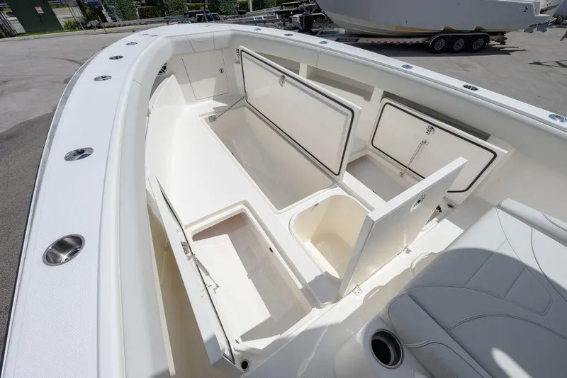 Slide: The Image of 2025 SeaVee 320B boat interior with open storage compartments and seating. - 7