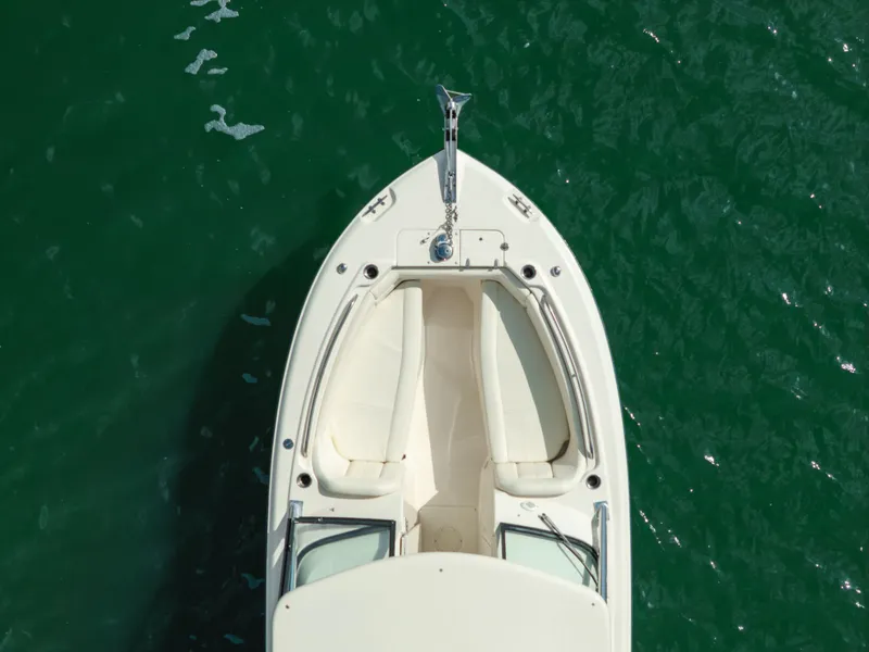 Slide: The Image of 2018 Grady-White Freedom 255 boat on calm green water, aerial view. - 15