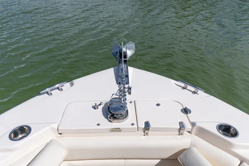 Slide: The Image of 2018 Grady-White Freedom 255 boat bow with anchor, on calm water. - 34