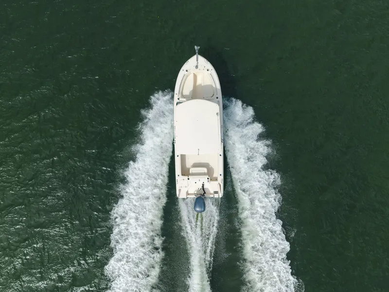 Slide: The Image of Aerial view of 2018 Grady-White Freedom 255 boat cruising on water. - 6
