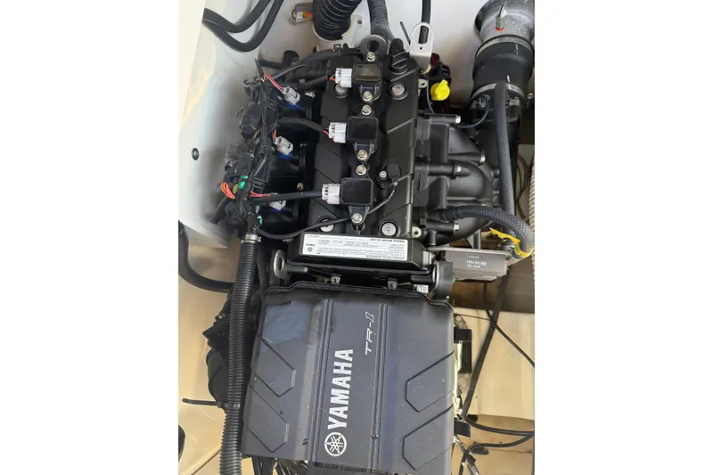 Slide: The Image of Engine compartment of 2018 Yamaha Boats 210 FSH Sport, showcasing TR-1 engine components. - 16
