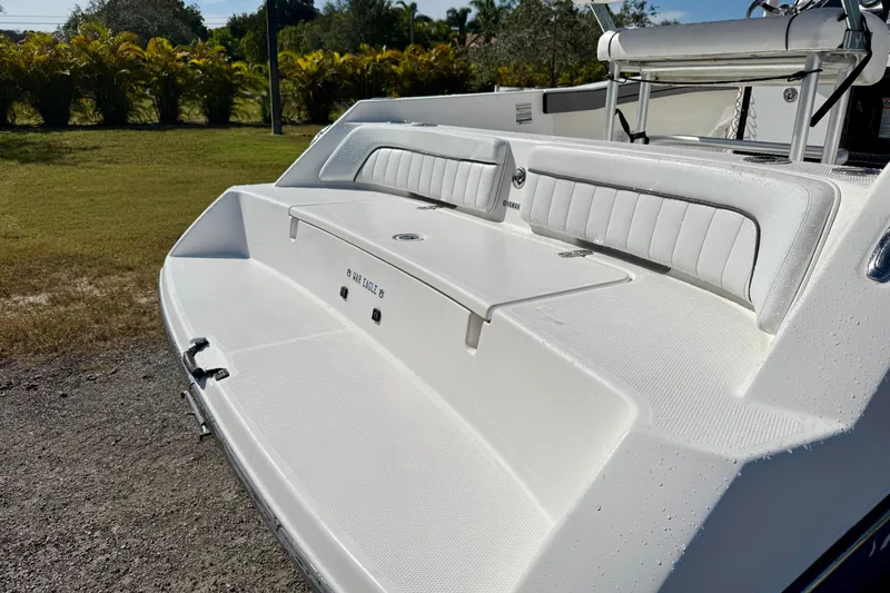 Slide: The Image of 2018 Yamaha Boats 210 FSH Sport with sleek white seating and deck. - 17