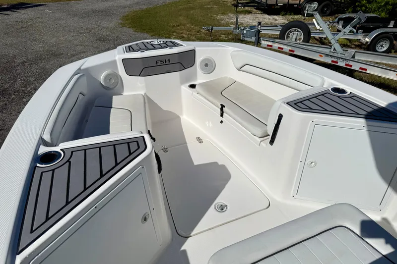 Slide: The Image of 2018 Yamaha Boats 210 FSH Sport interior with seating and storage compartments. - 5