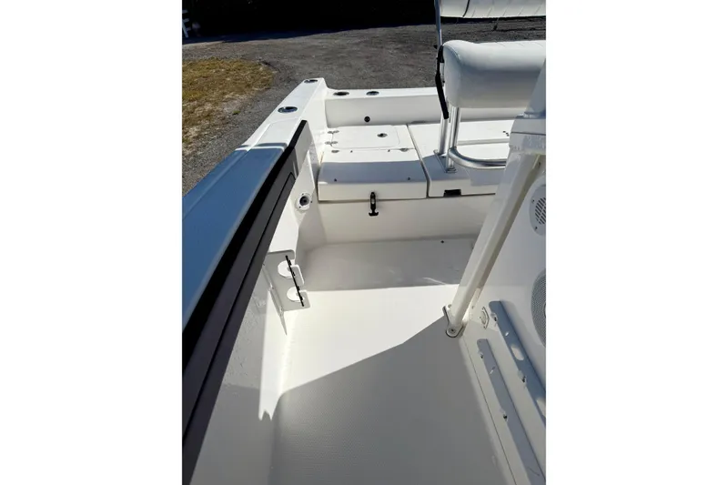 Slide: The Image of 2018 Yamaha Boats 210 FSH Sport interior, featuring seating and storage compartments. - 9