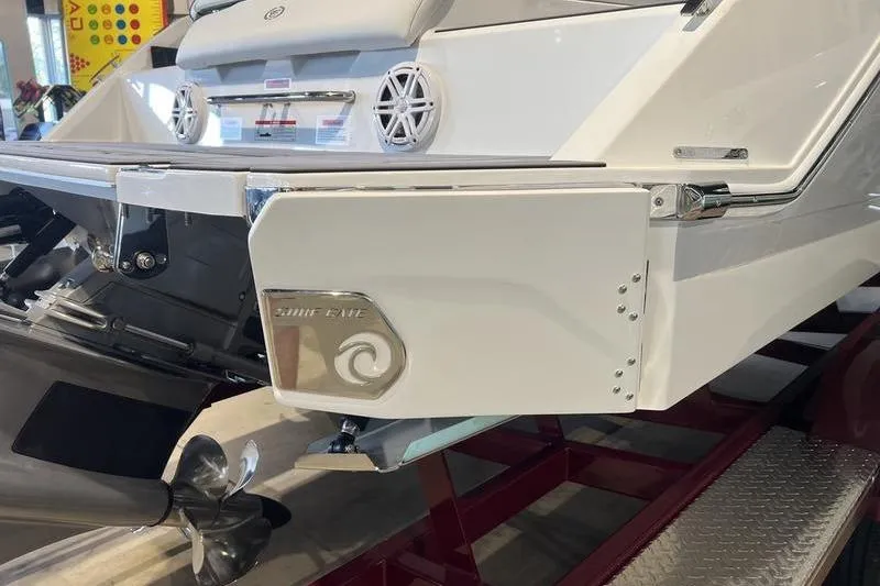 Slide: The Image of 2025 Cobalt CS23 Surf boat rear view with propeller and swim platform. - 23