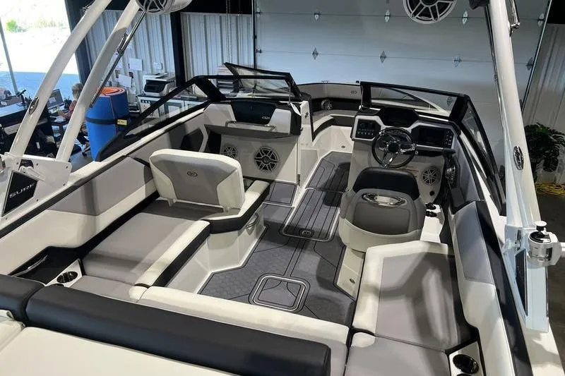 Slide: The Image of 2025 Cobalt CS23 Surf boat interior with modern seating and sleek dashboard design. - 26