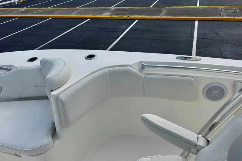 Slide: The Image of 2023 Key West 263 FS boat interior with white seating and speaker. - 13