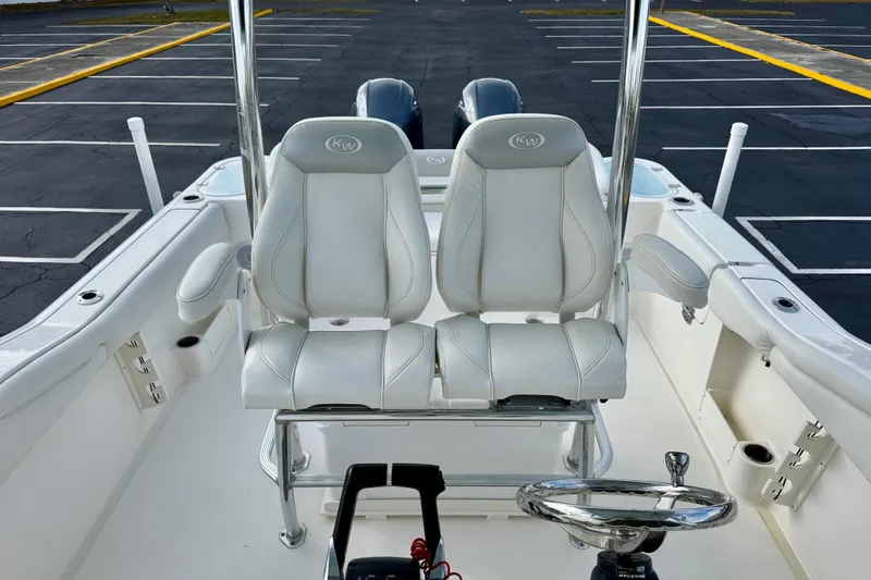 Slide: The Image of 2023 Key West 263 FS boat interior with dual white leather seats. - 22