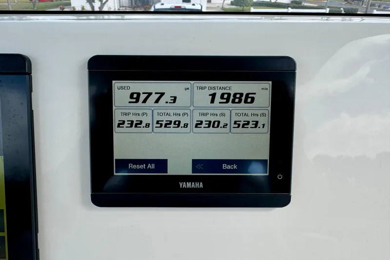 Slide: The Image of Yamaha display showing fuel usage and trip distance on 2023 Key West 263 FS boat. - 28